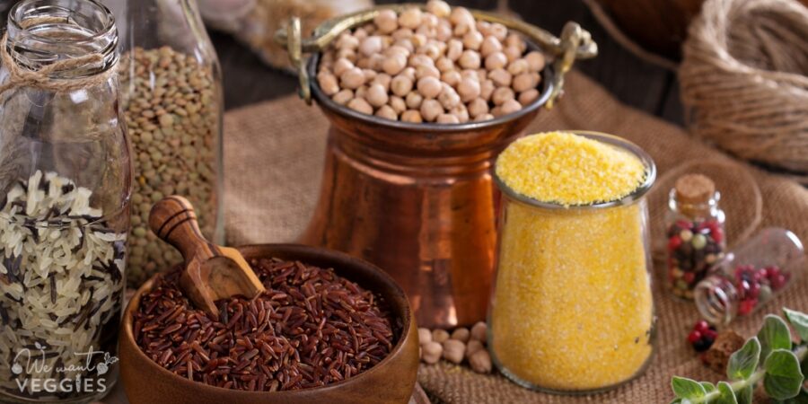 Variety of pantry grains & beans on a wooden table