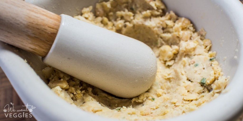 Mashed chickpeas in a mortar and pestle