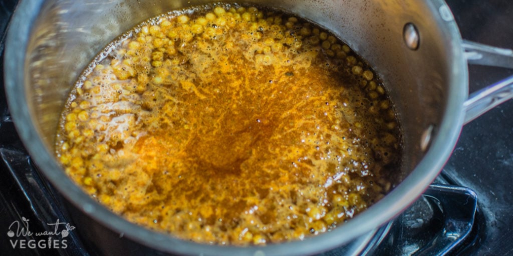 Lentil mixture simmering with broth.