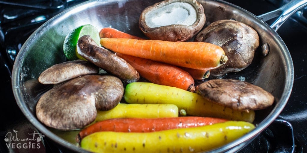 Carrots, mushrooms, lime & garlic in a saute pan