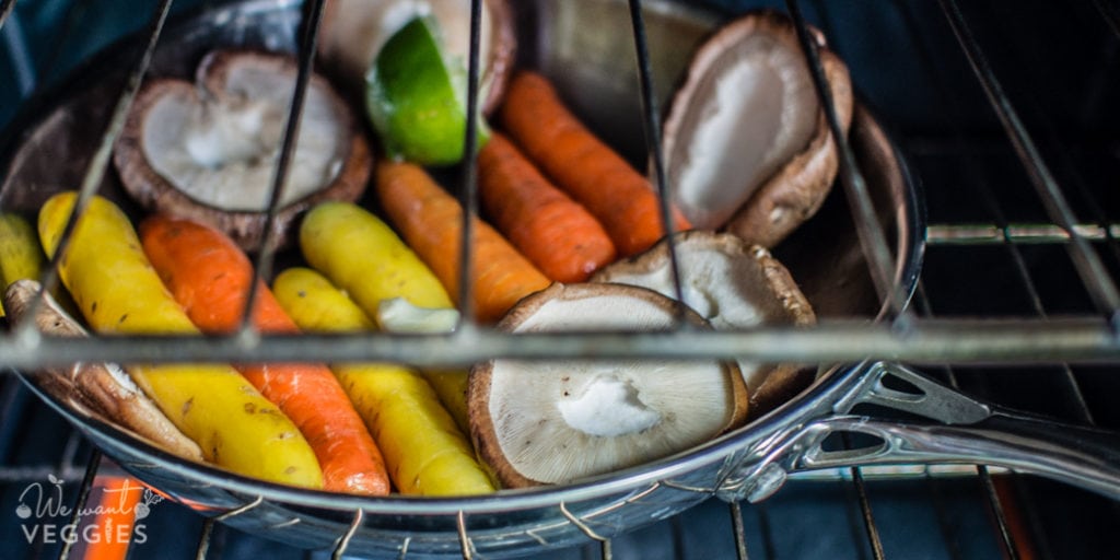 Saute pan with carrots & mushrooms in the oven.