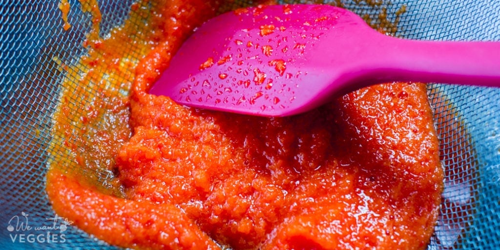 Pepper puree in a strainer.