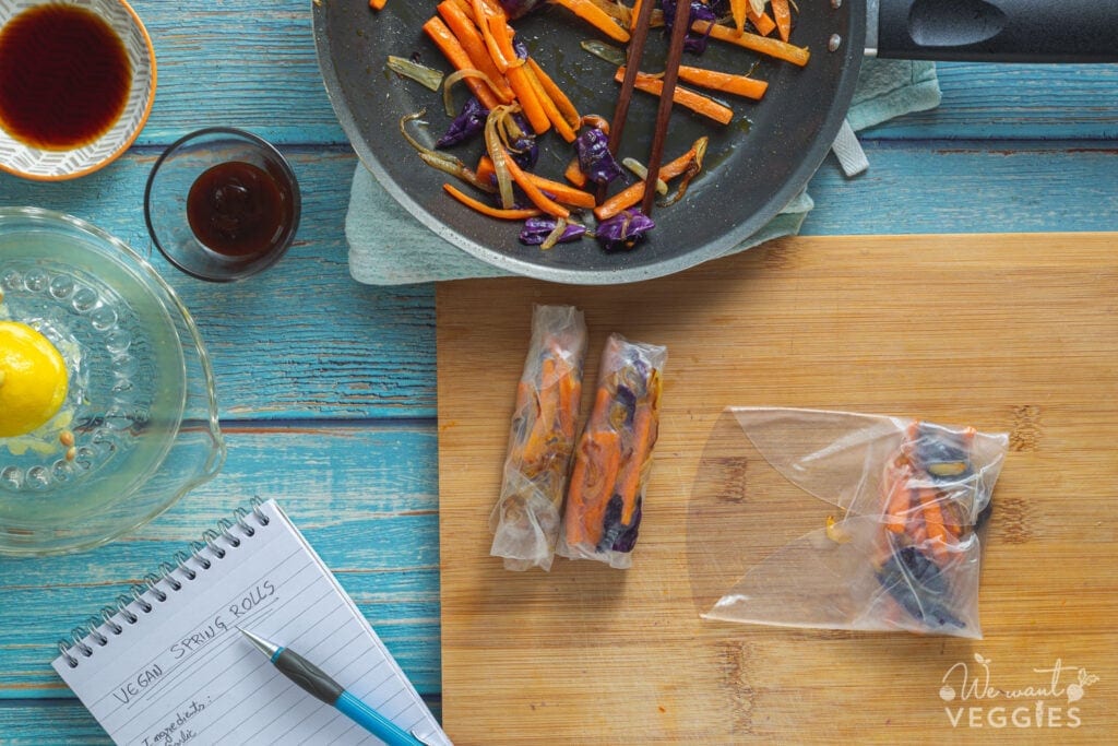 Wrapping veggies on a cutting board