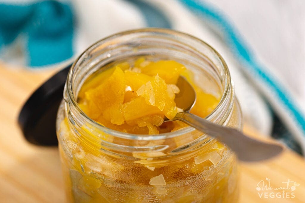 Mango chutney in jar with spoon