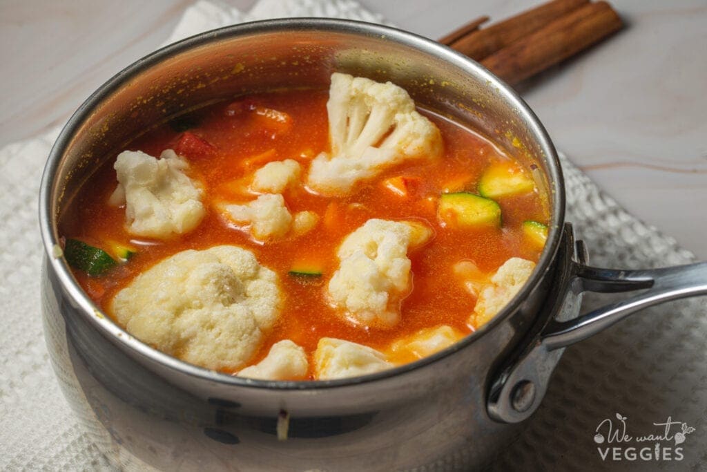 Vegetables simmer in pot