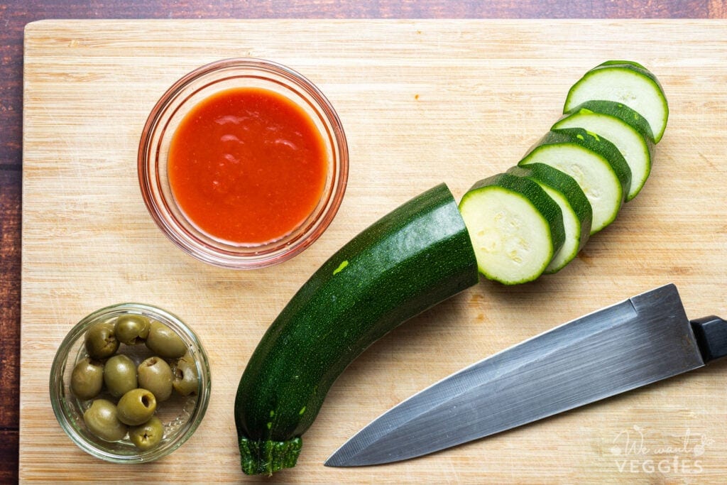 Slided zucchini on cutting board