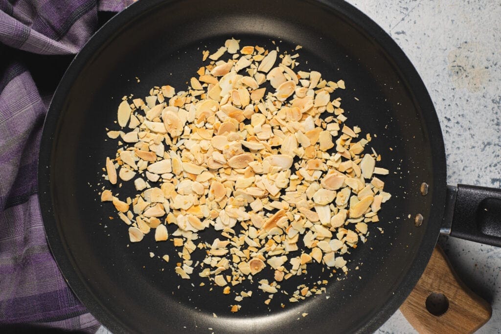 Almond slivers toasting in pan