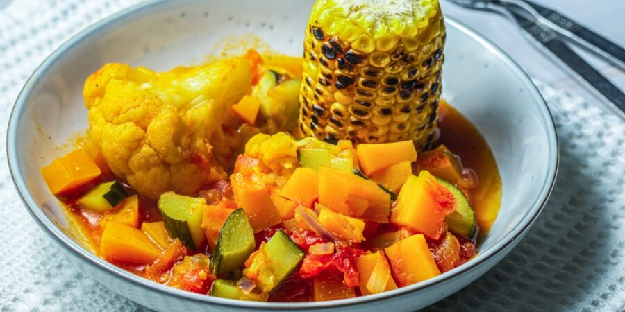 Vegetable tagine with grilled corn in a bowl
