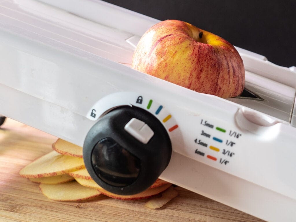 Apple on mandoline slicer