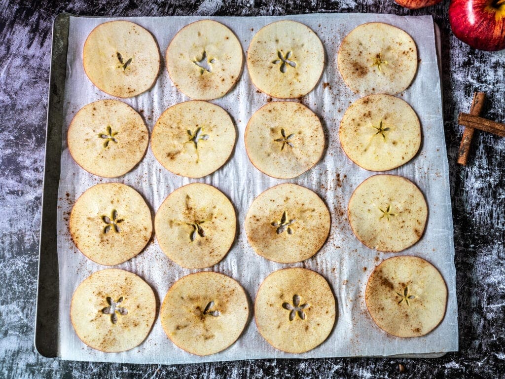 Spiced slices on baking sheet with parchment