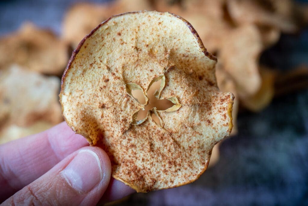 Holding up an apple chip