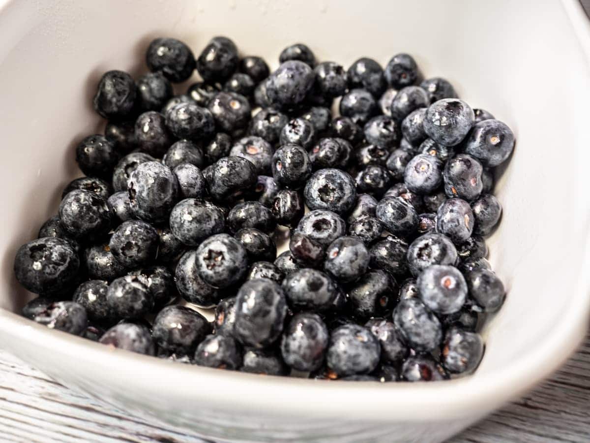 Blueberries in prepared baking dish.