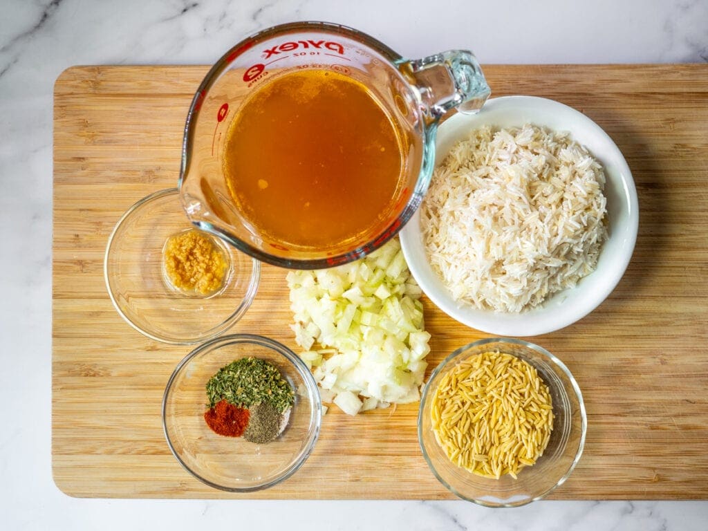 Broth, rice, orzo, onion, seasonings, garlic.