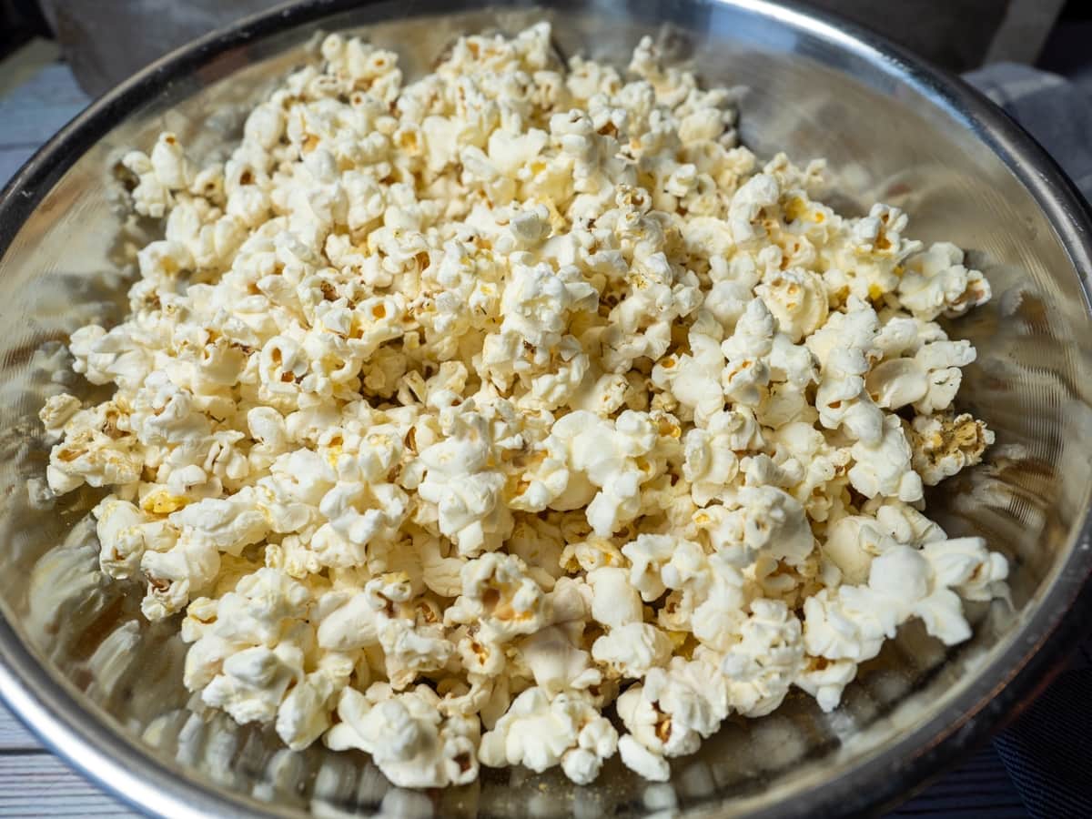 Seasoned popcorn in mixing bowl